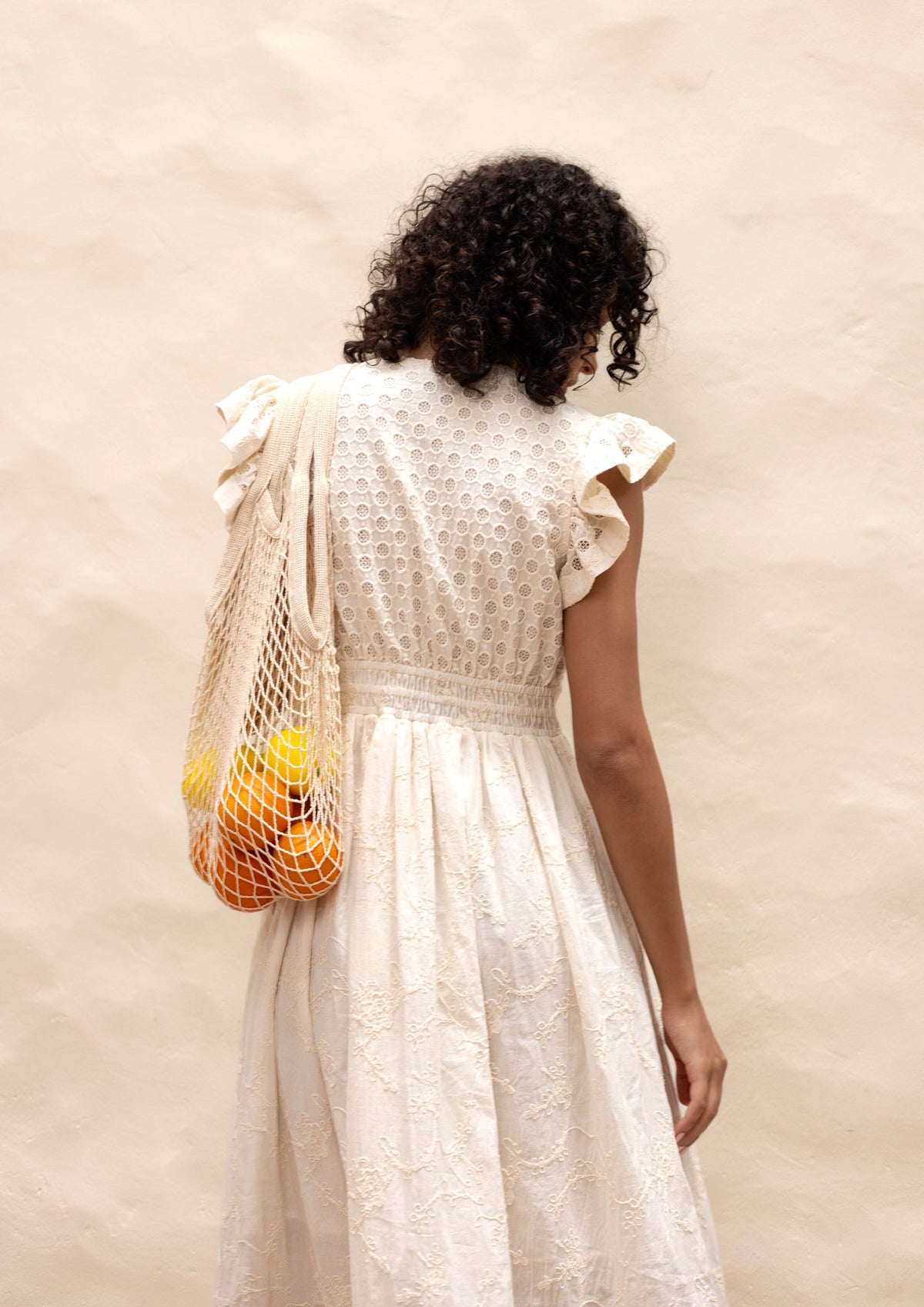 Emily Lovelock Madeline Broderie Anglaise Dress in ivory - bodice and heart button detail
