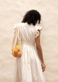 Emily Lovelock Madeline Broderie Anglaise Dress in ivory - bodice and heart button detail