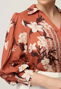 Close-up of the crossover cut-out sleeve detail on the OnceWas Nerine shirt
